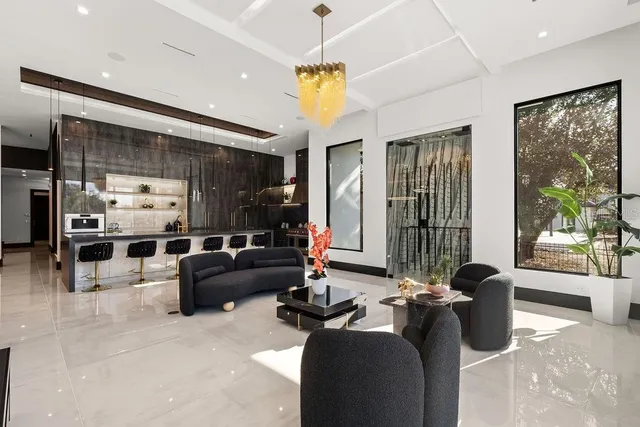 a bathroom with a glass shower door and mirror