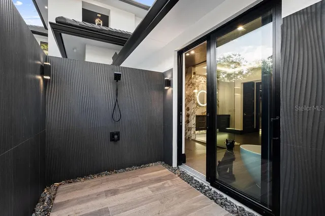 a bedroom with a bed and a lamp