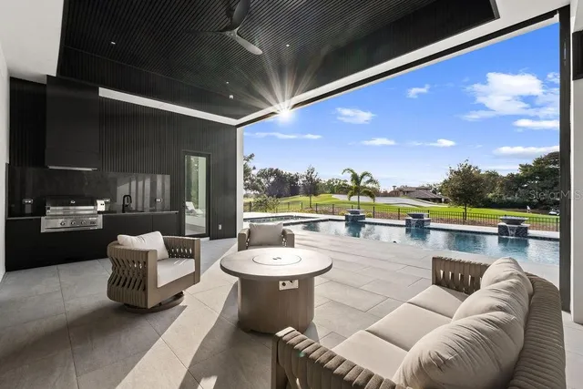 an aerial view of a house with a yard and garden