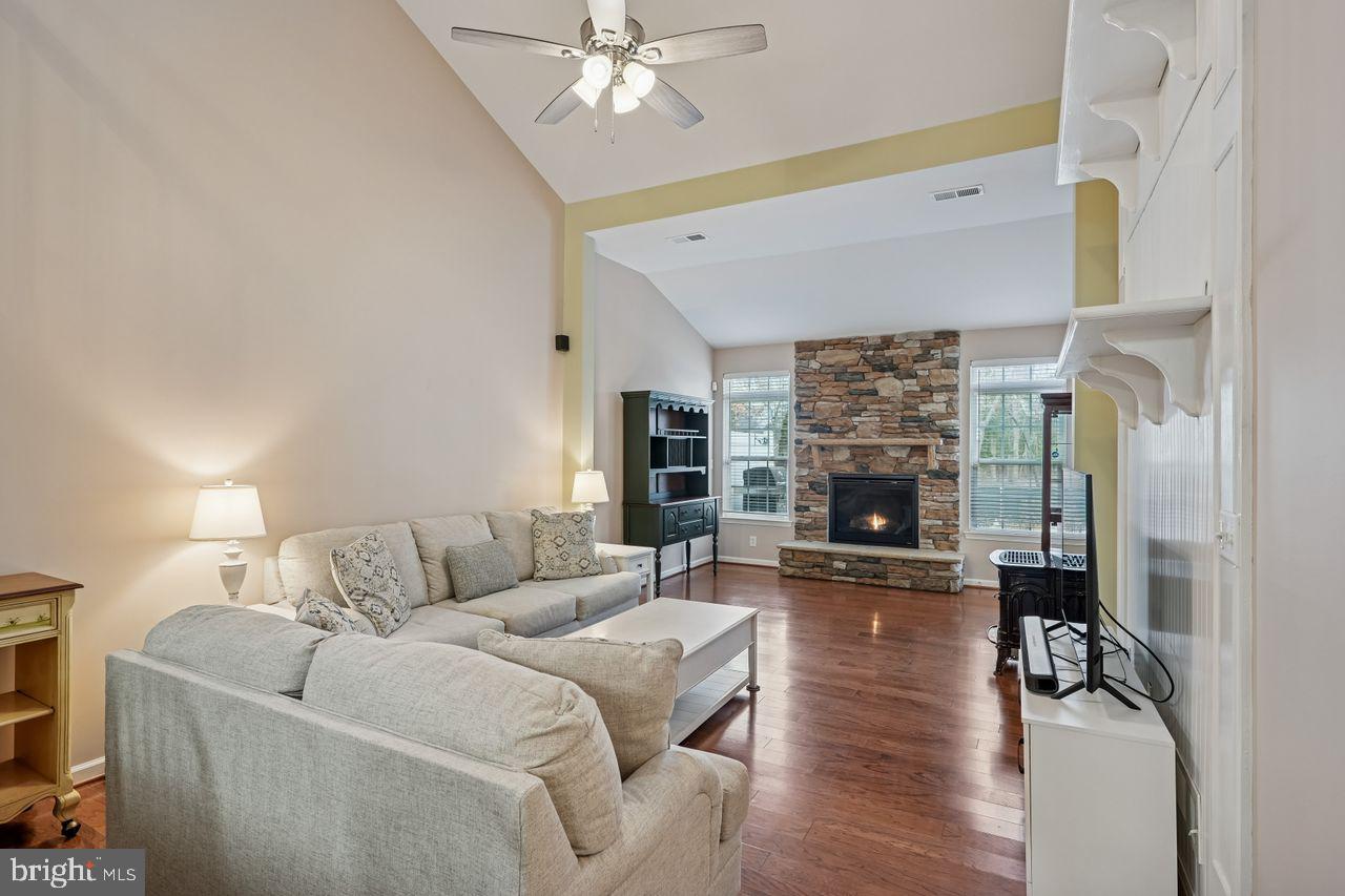 36318 Ridgeshore Lane Millville, DE 19967 - Photo 8 of 29 Open Living Room with Stone Propane Fireplace