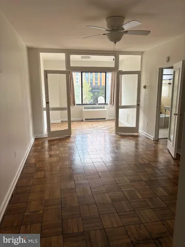 a view of an empty room and window