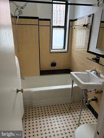 a bathroom with a sink and a bathtub