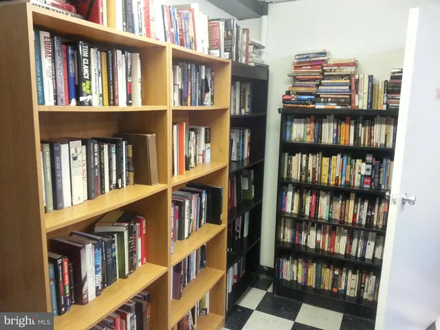 a living room with lots of books