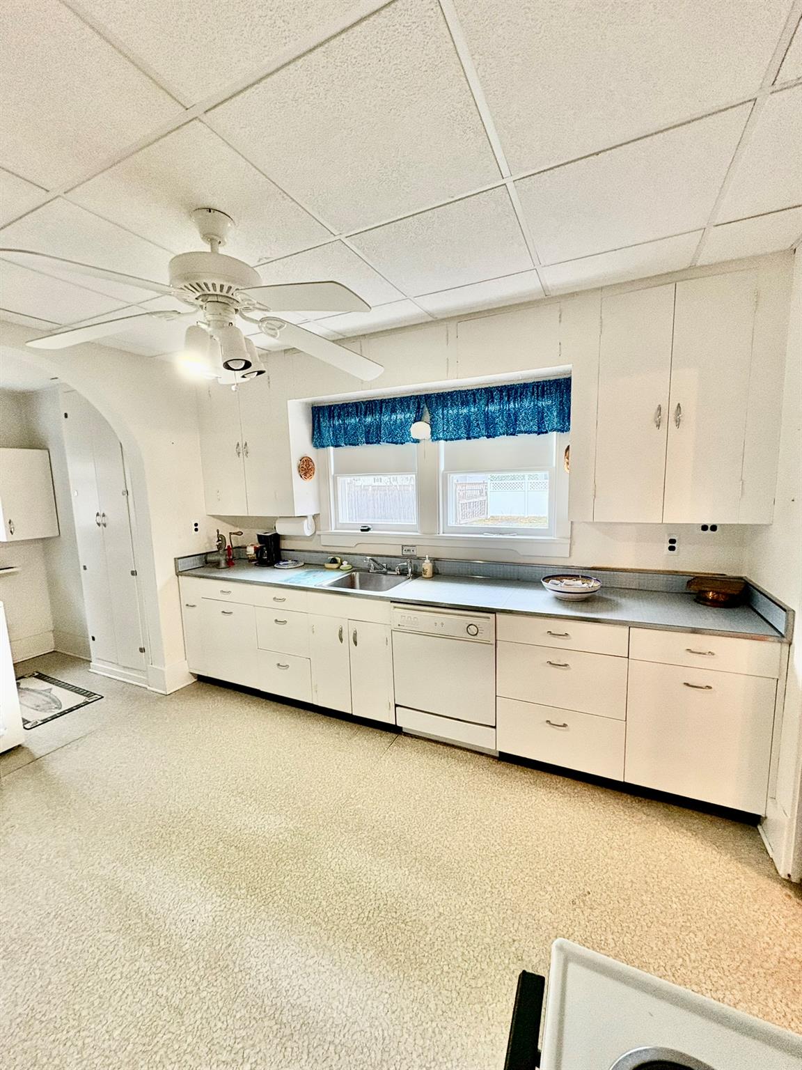 123 Rockland Road Roscoe, NY 12776 - Photo 3 of 31 Kitchen with a drop ceiling, a ceiling fan, a sink, and white dishwasher