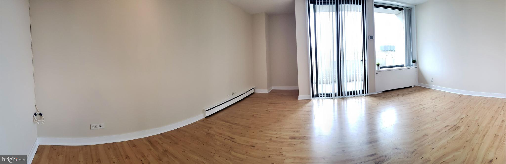 1250 4th Street Southwest, Unit W813 Washington, DC 20024 - Photo 11 of 26 a view of a room with wooden floor and a window