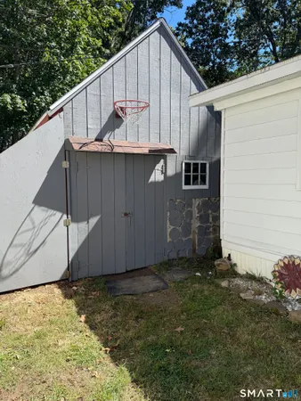 a backyard of a house with wooden fence
