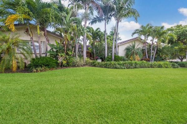 201 Oregon Lane Boca Raton, FL 33487 - Photo 1 of 31 a view of a garden with a building in the background