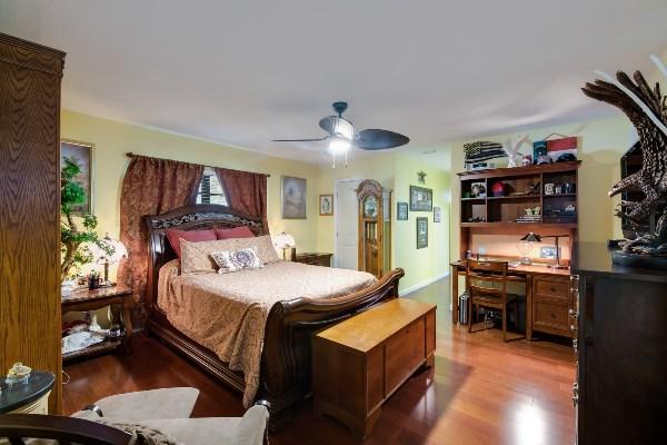 201 Oregon Lane Boca Raton, FL 33487 - Photo 20 of 31 a bed room with a bed and a book shelf