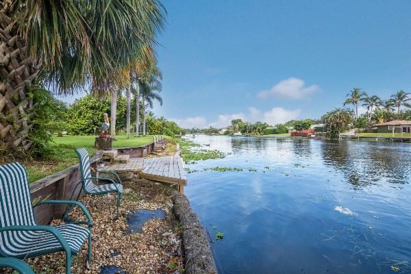201 Oregon Lane Boca Raton, FL 33487 - Photo 2 of 31 a view of a lake with couches and city view