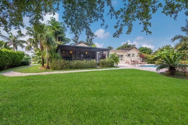 201 Oregon Lane Boca Raton, FL 33487 - Photo 30 of 31 a view of house with backyard and a garden