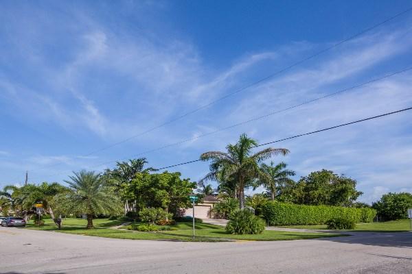 201 Oregon Lane Boca Raton, FL 33487 - Photo 3 of 31 a front view of a house with a yard