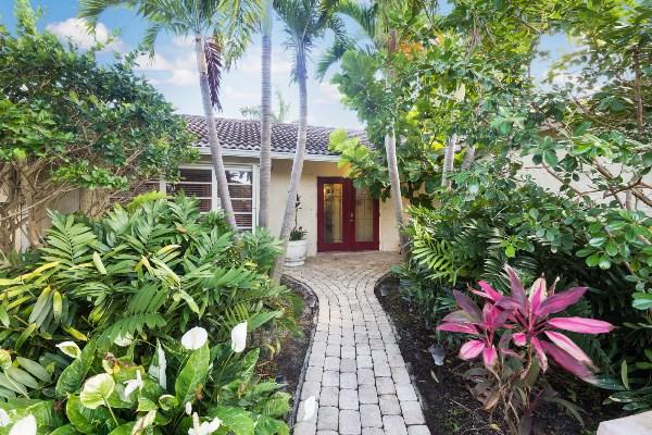 201 Oregon Lane Boca Raton, FL 33487 - Photo 5 of 31 a front view of a house with a yard