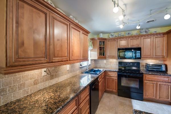 201 Oregon Lane Boca Raton, FL 33487 - Photo 7 of 31 a kitchen with granite countertop stainless steel appliances a stove sink and cabinets