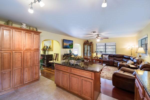 201 Oregon Lane Boca Raton, FL 33487 - Photo 8 of 31 a living room with furniture a chandelier fan and a window