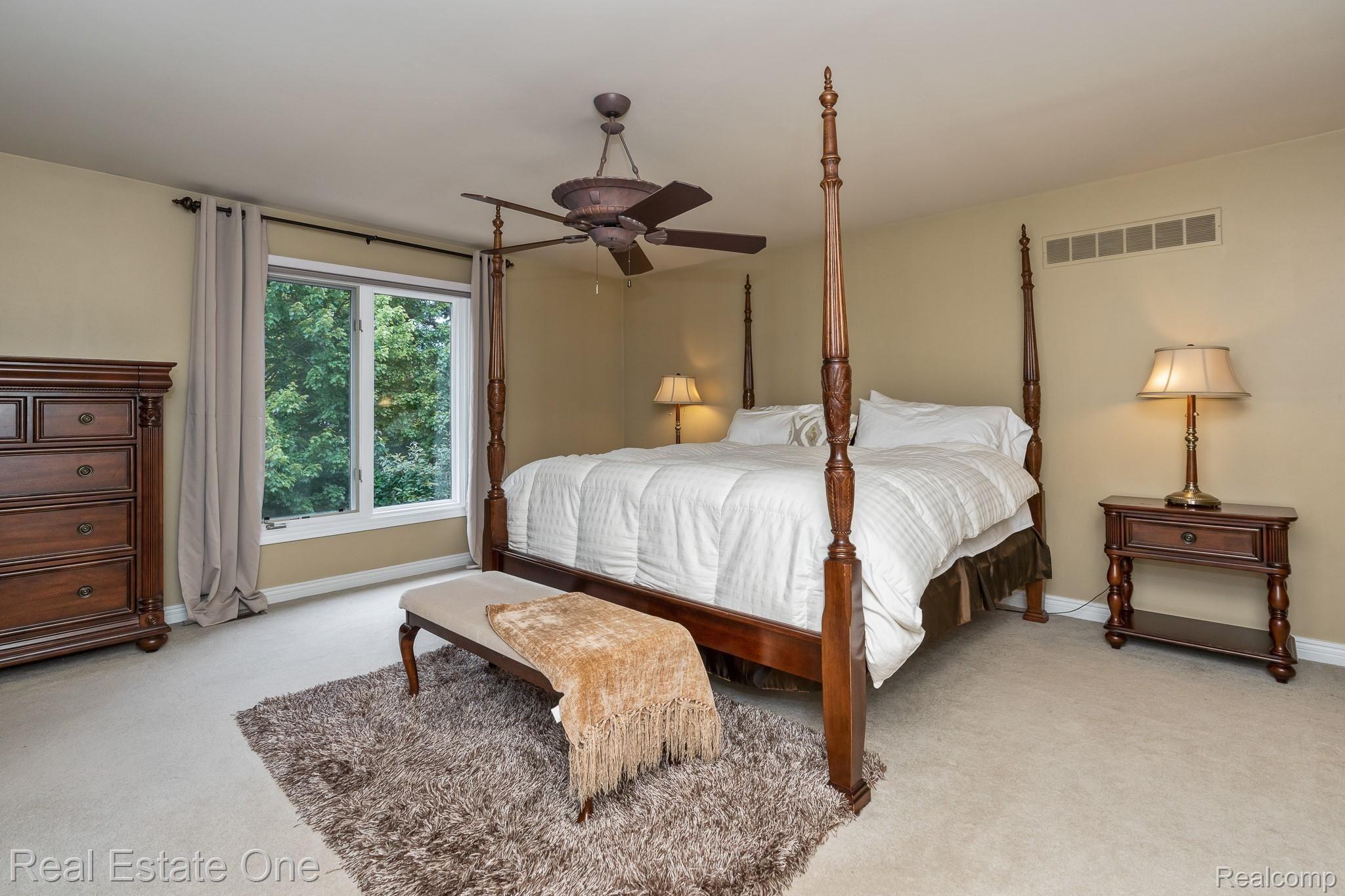 1345 Ross Lane Rochester, MI 48306 - Photo 24 of 61 OWNER'S SUITE FEATURES STUNNING BACKYARD VIEWS AND A MASTER BATHROOM WITH JETTED TUB & SEPARATE SHOWER, HUGE WALK-IN CLOSET