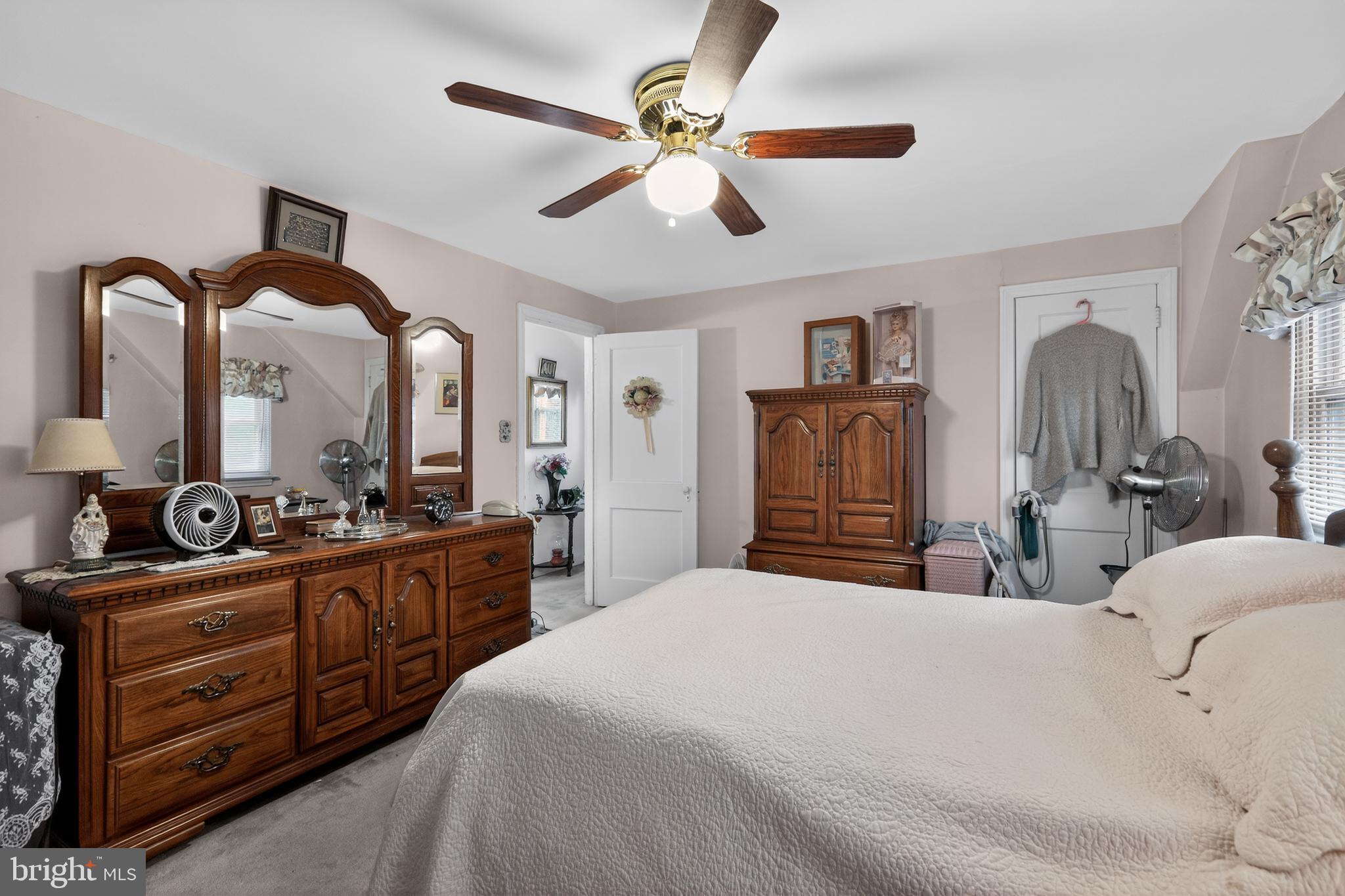 1424 Burmont Road Havertown, PA 19083 - Photo 21 of 37 a bedroom with a bed and dresser with mirror