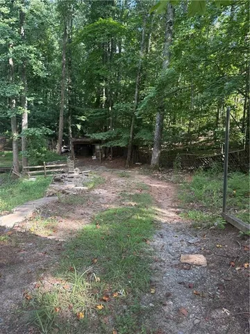 a view of outdoor space with trees all around