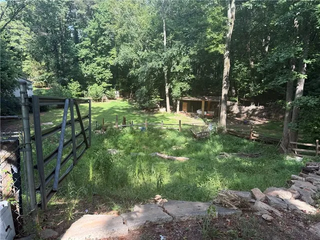 a backyard of a house with lots of green space