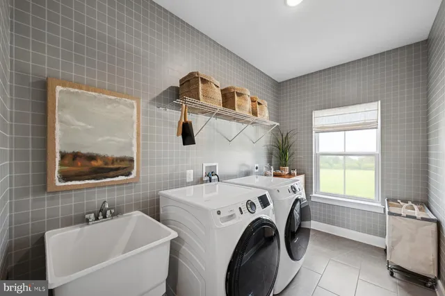 a spacious bathroom with a tub sink and mirror