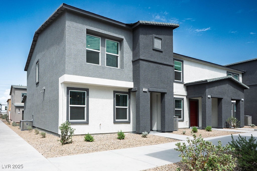 Modern home featuring stucco siding