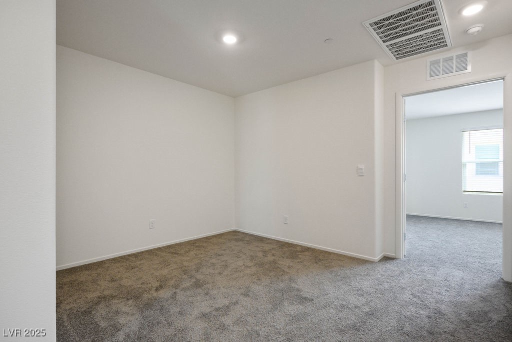 6184 Hibiscus Gdn Street North Las Vegas, NV 89081 - Photo 16 of 35 Carpeted spare room featuring recessed lighting and baseboards