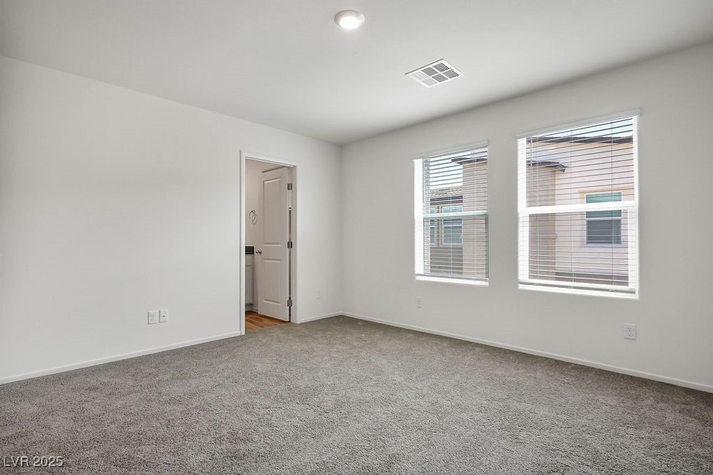 6184 Hibiscus Gdn Street North Las Vegas, NV 89081 - Photo 18 of 35 Carpeted spare room featuring baseboards