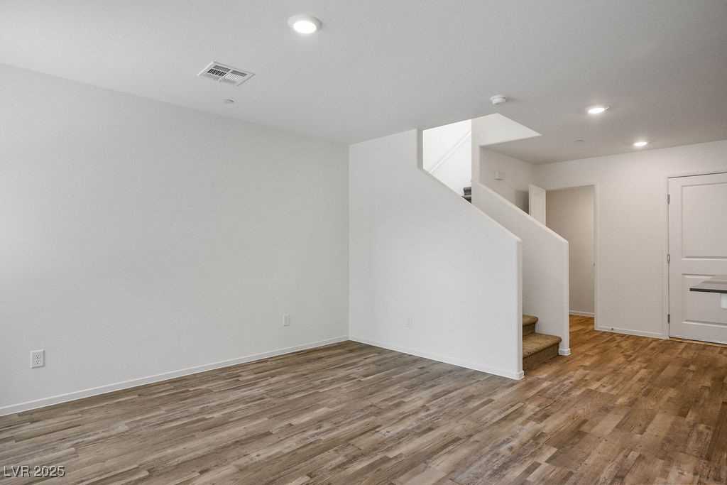 6184 Hibiscus Gdn Street North Las Vegas, NV 89081 - Photo 4 of 35 Below grade area with stairway, wood finished floors, and recessed lighting