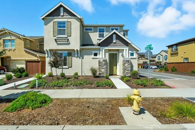 a front view of a house with garden