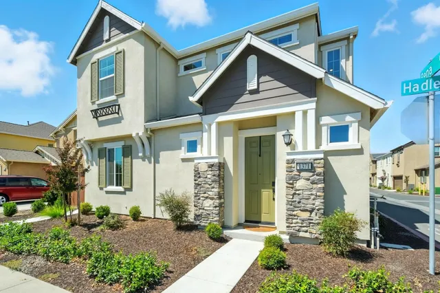 a front view of a house with garden