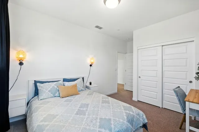 a bedroom with a bed and furniture