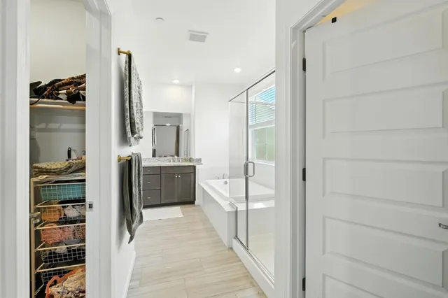a bathroom with a double vanity sink and mirror