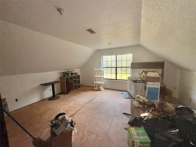 a room with furniture and a window