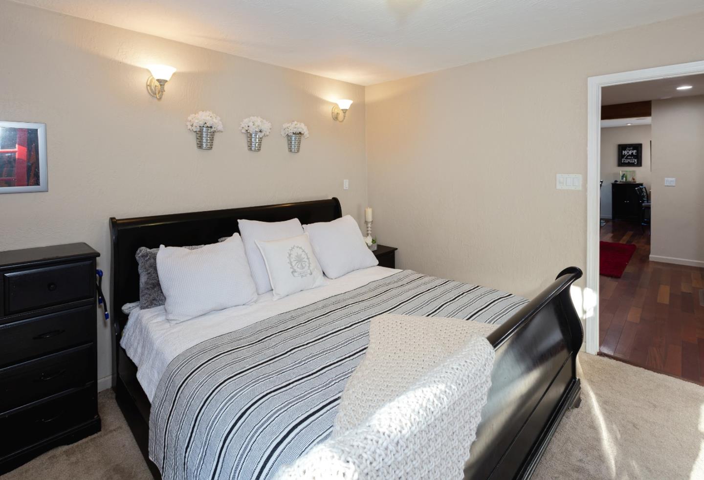 100 Smith Road Watsonville, CA 95076 - Photo 15 of 25 a bedroom with a bed and wooden floor
