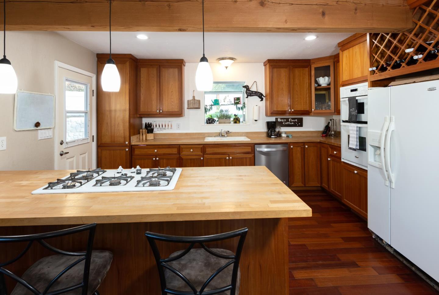 100 Smith Road Watsonville, CA 95076 - Photo 5 of 25 a large kitchen with a table and chairs