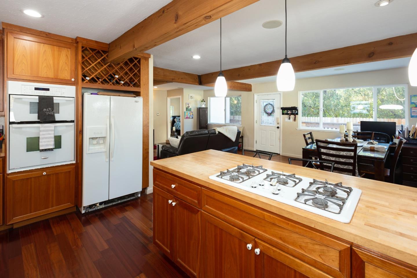100 Smith Road Watsonville, CA 95076 - Photo 7 of 25 a kitchen with stainless steel appliances granite countertop a refrigerator a stove and a wooden floors