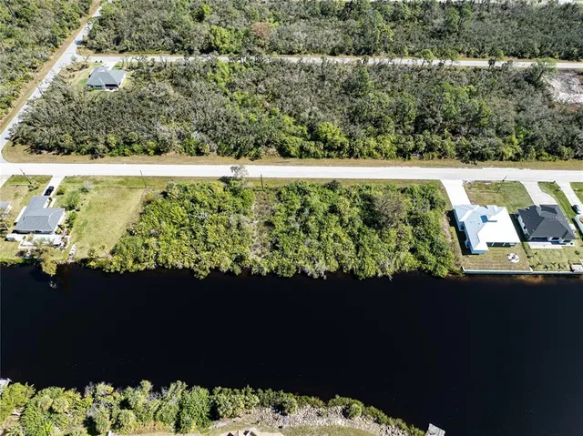 a view of a lake with a big yard