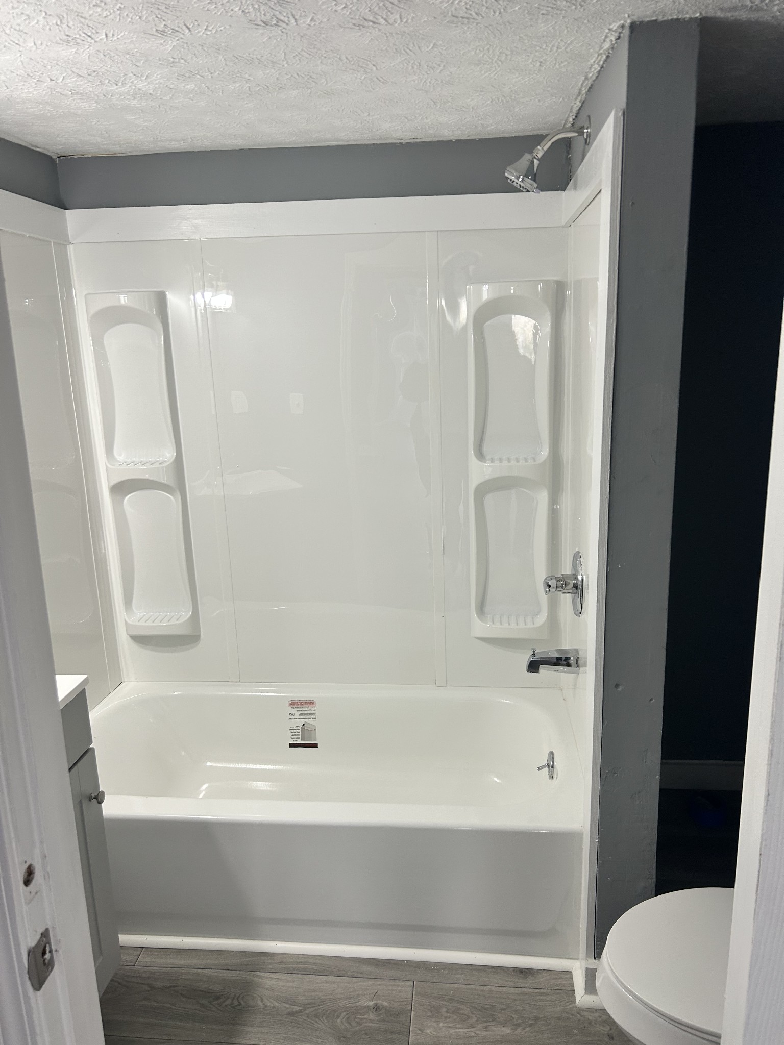 110 Demase Street Portland, TN 37148 - Photo 11 of 13 a bathroom with a bathtub and a toilet