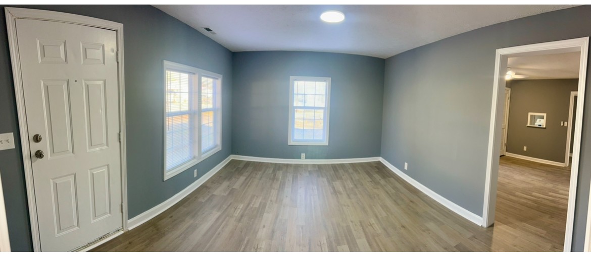 110 Demase Street Portland, TN 37148 - Photo 4 of 13 an empty room with wooden floor and windows