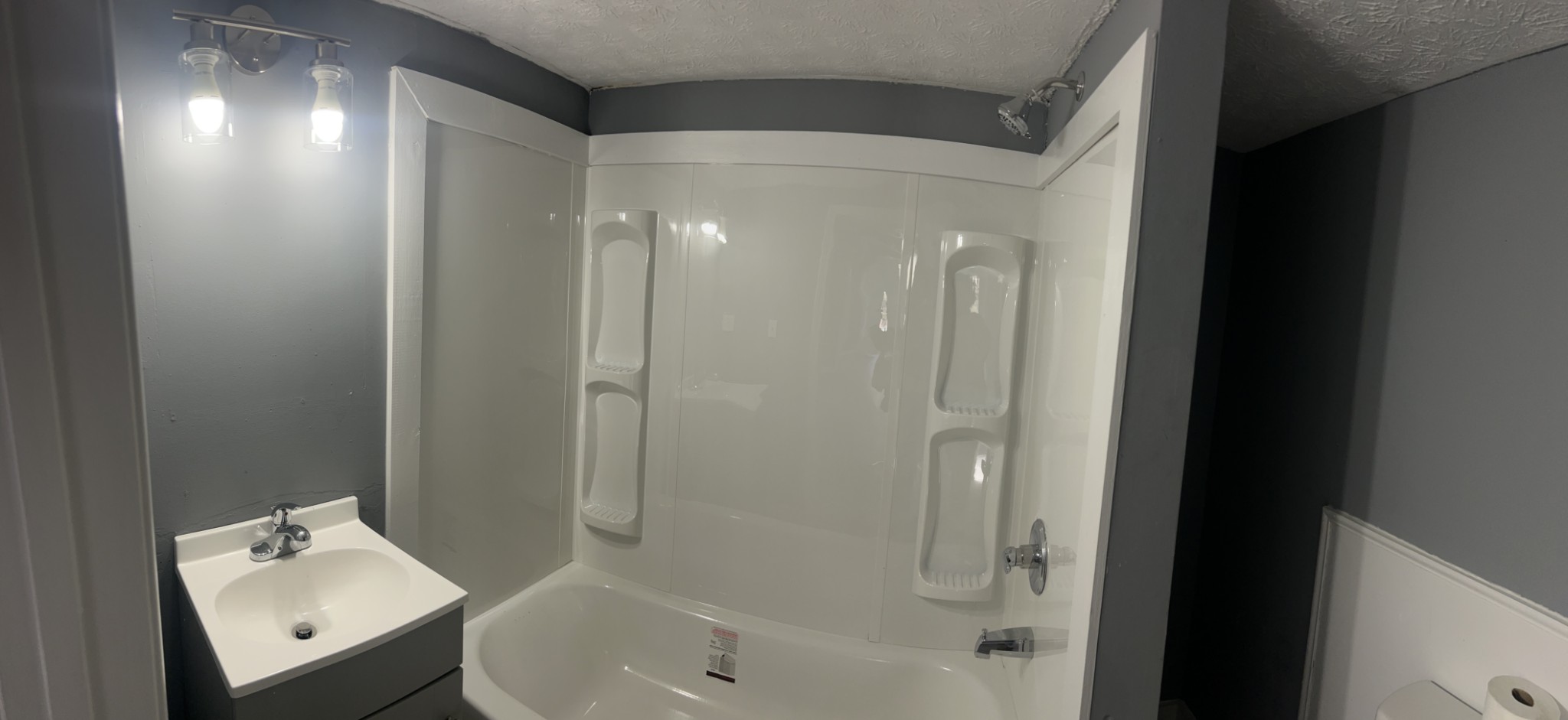 110 Demase Street Portland, TN 37148 - Photo 10 of 13 a bathroom with a tub shower and sink