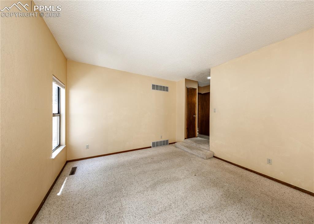 55 Bonnymede Road, Unit S Pueblo, CO 81001 - Photo 10 of 24 an empty room with windows