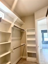 1315 West 24th Street, Unit B Houston, TX 77008 - Photo 18 of 26 a view of walk in closet with empty racks