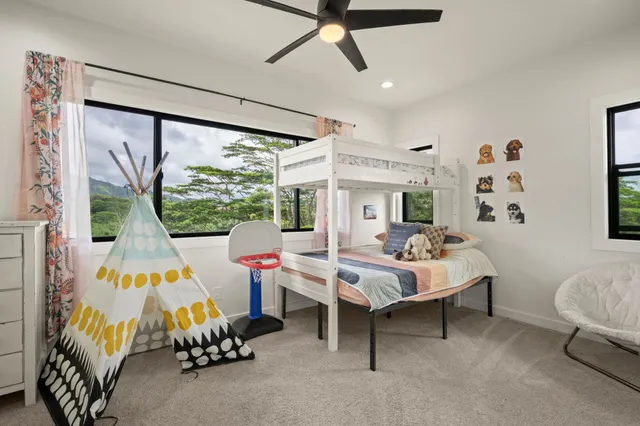 a bed room with a bed and a window