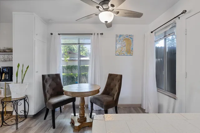 a work room with furniture and a window