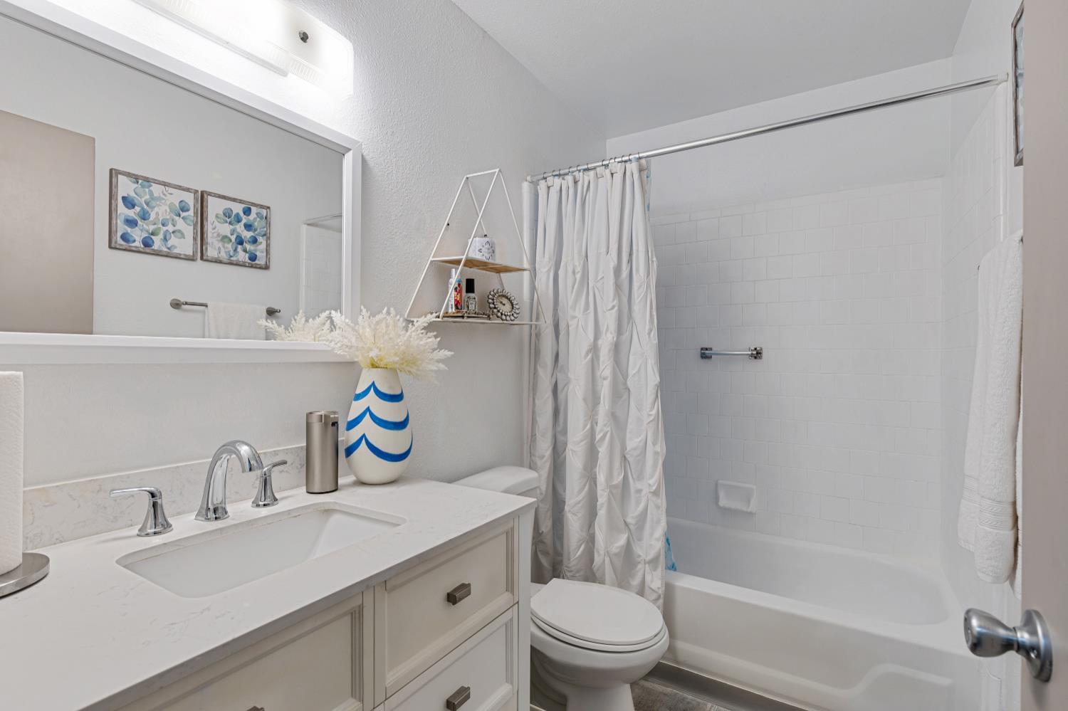 6415 Plymouth Road Stockton, CA 95207 - Photo 17 of 29 a bathroom with a sink a toilet and a shower