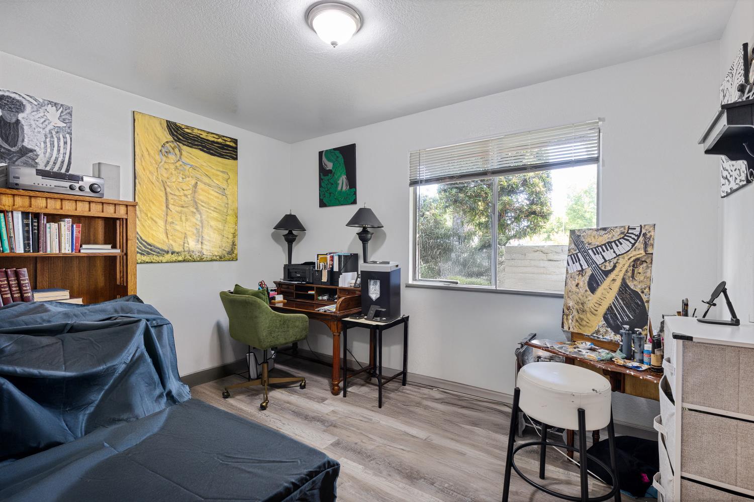 6415 Plymouth Road Stockton, CA 95207 - Photo 19 of 29 a view of a workspace with furniture and a window