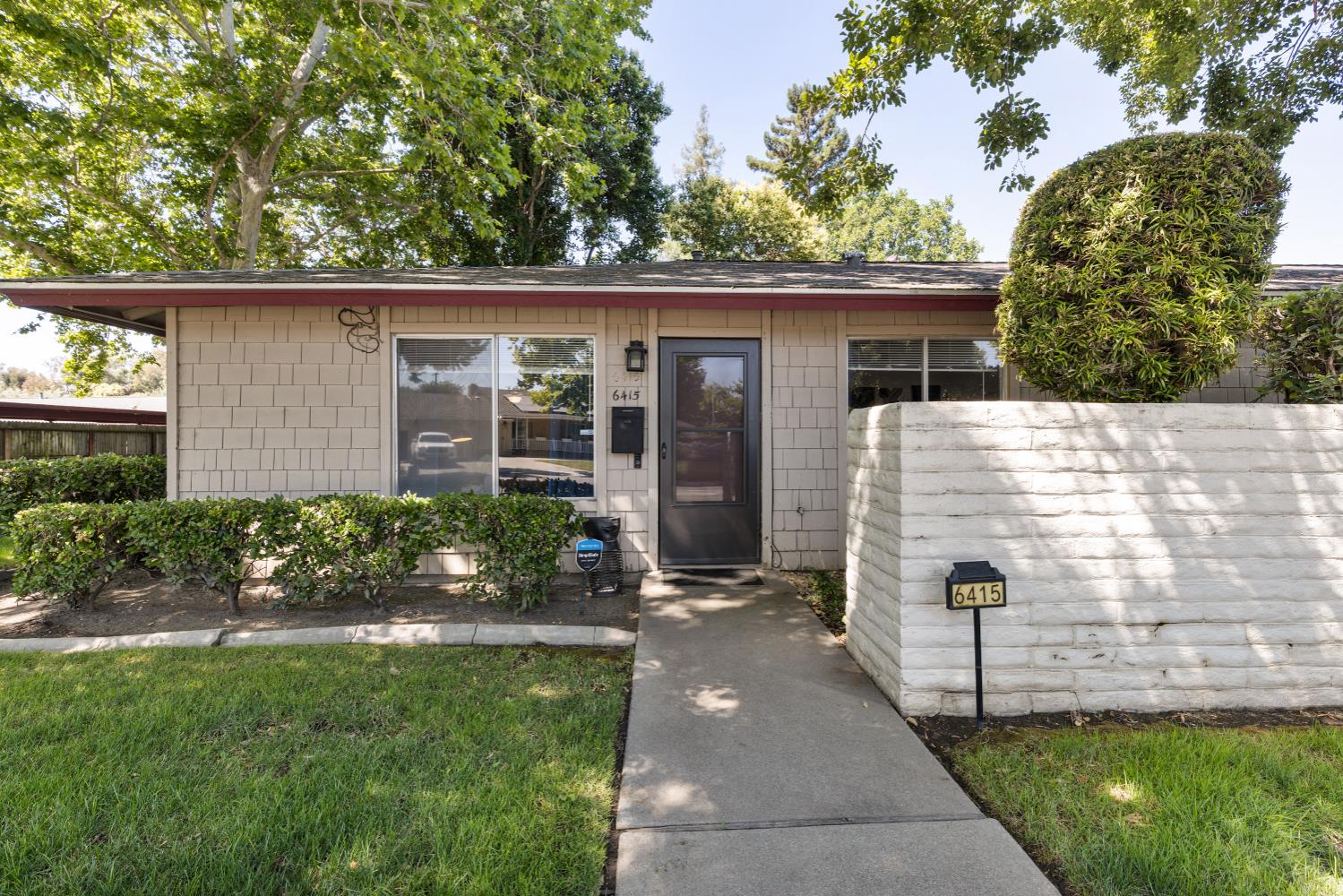 6415 Plymouth Road Stockton, CA 95207 - Photo 2 of 29 a view of a house with a yard