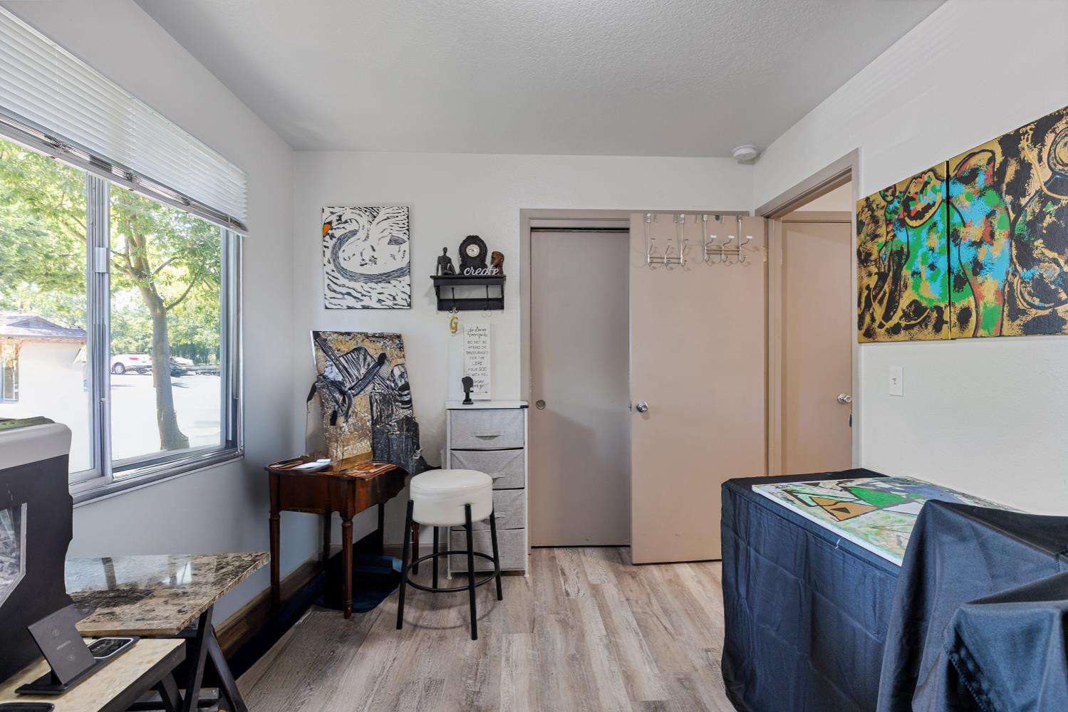 6415 Plymouth Road Stockton, CA 95207 - Photo 21 of 29 a view of a workspace with furniture and a window