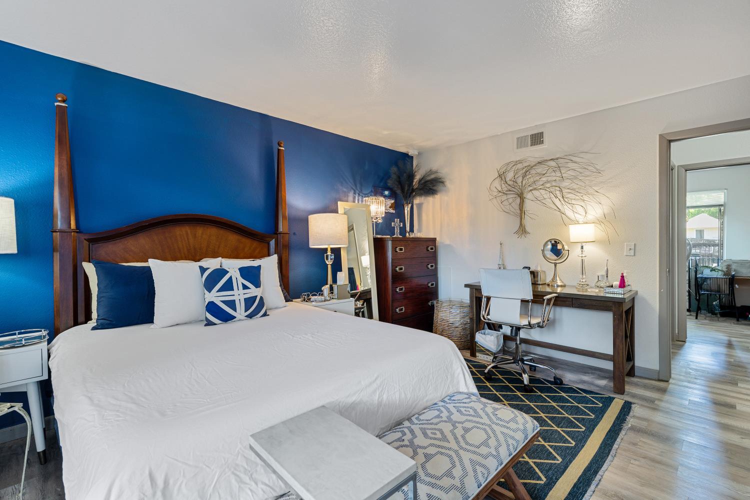 6415 Plymouth Road Stockton, CA 95207 - Photo 24 of 29 a bedroom with a bed and wooden floor