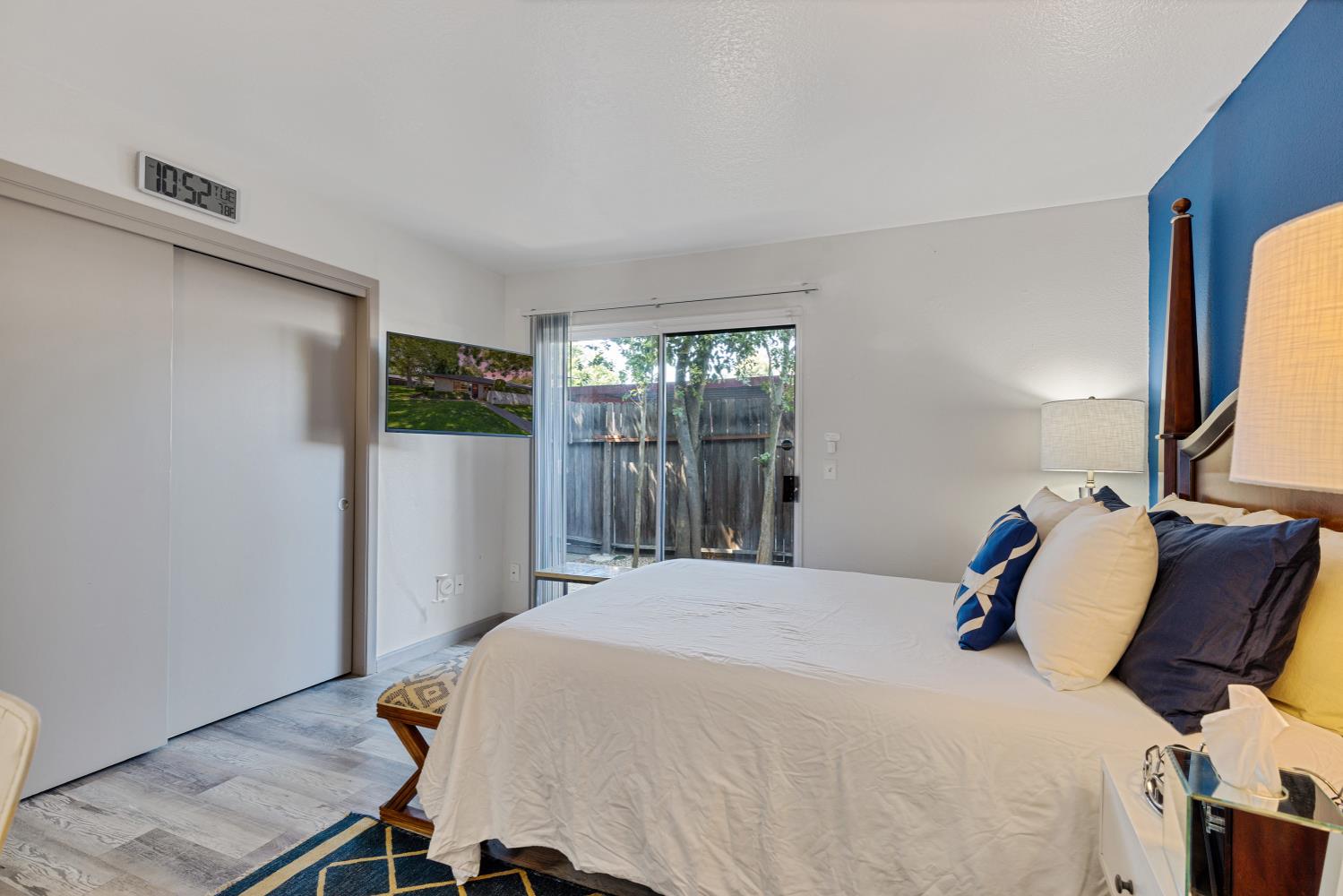 6415 Plymouth Road Stockton, CA 95207 - Photo 25 of 29 a bedroom with a bed and wooden floor