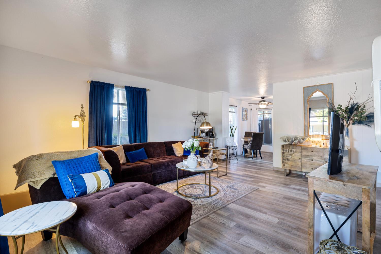 6415 Plymouth Road Stockton, CA 95207 - Photo 3 of 29 a living room with furniture and wooden floor